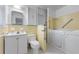 Bathroom featuring yellow tile, and a walk-in bathtub at 2655 Hayden Dr, East Point, GA 30344