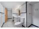 Finished basement bathroom with a vanity sink, mosaic tile floor, and shower at 2655 Hayden Dr, East Point, GA 30344