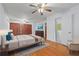 Large bedroom includes hardwood floors, a ceiling fan, and closet at 2655 Hayden Dr, East Point, GA 30344