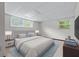 Finished basement bedroom features two windows and neutral finishes at 2655 Hayden Dr, East Point, GA 30344