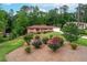 Well-maintained home with beautiful landscaping and mature trees providing shade and privacy at 2655 Hayden Dr, East Point, GA 30344