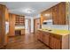Kitchen boasts wooden cabinets, built-in shelving, and hardwood floors at 2655 Hayden Dr, East Point, GA 30344