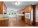 Well-lit kitchen featuring wood cabinets, functional appliances, and ample counter space for meal preparation at 2655 Hayden Dr, East Point, GA 30344