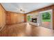 Cozy living room boasts a brick fireplace and wood-paneled walls at 2655 Hayden Dr, East Point, GA 30344