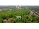 Aerial view of a property at 3370 Ashton Drive near the Lambert High School with lush green tree coverage at 3370 Ashton Dr, Suwanee, GA 30024
