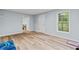 Finished basement with wood floors, natural light, and a neutral color scheme at 3370 Ashton Dr, Suwanee, GA 30024