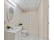 Cozy bathroom featuring a shower with curtain, white tiling and flooring at 3370 Ashton Dr, Suwanee, GA 30024