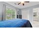 Bedroom features natural light from large window and a double door closet at 3370 Ashton Dr, Suwanee, GA 30024