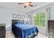 Comfortable bedroom with a large window offering view of the outdoors at 3370 Ashton Dr, Suwanee, GA 30024