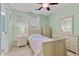 Inviting bedroom with light green walls, matching furniture, and bright natural light at 3370 Ashton Dr, Suwanee, GA 30024