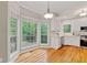 Bright kitchen with stainless appliances, white cabinets, and access to the deck at 3370 Ashton Dr, Suwanee, GA 30024