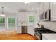 Spacious kitchen with eat-in area, stainless appliances, and white cabinetry at 3370 Ashton Dr, Suwanee, GA 30024