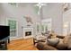 Bright living room with high ceilings, fireplace, and hardwood floors at 3370 Ashton Dr, Suwanee, GA 30024