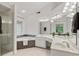 Elegant main bathroom with a glass-enclosed shower, soaking tub, and dual sinks at 3370 Ashton Dr, Suwanee, GA 30024