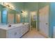Bathroom with double sinks, and a vanity with several drawers for storage at 1210 Lancelot Ct, Loganville, GA 30052