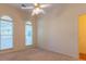 Spacious bedroom with two large windows and ceiling fan at 1210 Lancelot Ct, Loganville, GA 30052
