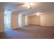 Spacious bonus room with neutral carpet and vaulted ceilings at 1210 Lancelot Ct, Loganville, GA 30052