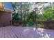 Relax on this wood deck that offers scenic backyard views and unique sunburst railing details at 1210 Lancelot Ct, Loganville, GA 30052