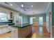 Kitchen with white cabinets, stainless appliances and an island perfect for dining at 1210 Lancelot Ct, Loganville, GA 30052