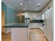 Kitchen with white cabinetry, stainless appliances and ample counter space at 1210 Lancelot Ct, Loganville, GA 30052