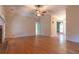 Spacious living room featuring hardwood floors, a fireplace, and ample natural light, ideal for entertaining at 1210 Lancelot Ct, Loganville, GA 30052