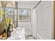 Renovated bathroom featuring shower/tub combo, marble floors, and modern finishes at 2608 Barge Sw Rd, Atlanta, GA 30331