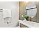 Updated bathroom features a stylish vanity, marble countertop, and modern fixtures at 2608 Barge Sw Rd, Atlanta, GA 30331