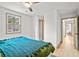 Bright bedroom with natural light, a ceiling fan, hardwood floors and a glimpse of the hallway at 2608 Barge Sw Rd, Atlanta, GA 30331