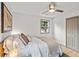 Bright bedroom featuring a ceiling fan, natural light, and a double door closet at 2608 Barge Sw Rd, Atlanta, GA 30331