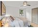 Comfortable bedroom featuring a ceiling fan, closet, and large window at 2608 Barge Sw Rd, Atlanta, GA 30331