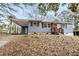 Charming home with covered parking, manicured lawn, and inviting entrance at 2608 Barge Sw Rd, Atlanta, GA 30331