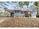 Attractive single-story home with covered parking, a bright red door, and classic shutters at 2608 Barge Sw Rd, Atlanta, GA 30331