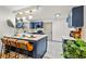 Modern kitchen featuring an island with bar seating, stainless appliances, and stylish backsplash at 2608 Barge Sw Rd, Atlanta, GA 30331