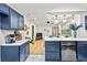 Open kitchen with island seating and stainless steel dishwasher at 2608 Barge Sw Rd, Atlanta, GA 30331