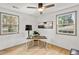 Bright home office featuring two windows, neutral paint, and hardwood floors at 2608 Barge Sw Rd, Atlanta, GA 30331