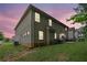 Wide backyard features a lush lawn and brick exterior, perfect for outdoor enjoyment at 412 Live Oak Pass, Loganville, GA 30052