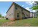 Wide backyard features a lush lawn and brick exterior, perfect for outdoor enjoyment at 412 Live Oak Pass, Loganville, GA 30052