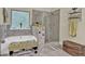 Bathroom with soaking tub, seamless glass shower, decorative wall and floor tiles and a decorative window at 412 Live Oak Pass, Loganville, GA 30052