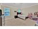 Bedroom with neutral paint and floor, decorated with play furniture, a window with blinds, and recessed ceiling lights at 412 Live Oak Pass, Loganville, GA 30052