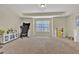 Large bonus room with ample natural light, neutral carpet, and plenty of space for a variety of uses at 412 Live Oak Pass, Loganville, GA 30052
