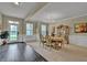 Formal dining room with hardwood floors, chandelier, and decorative china cabinet at 412 Live Oak Pass, Loganville, GA 30052
