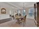 Formal dining room with hardwood floors, chandelier, and decorative mirror at 412 Live Oak Pass, Loganville, GA 30052