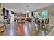 Open kitchen with dark cabinets, hardwood floors, and stainless steel appliances at 412 Live Oak Pass, Loganville, GA 30052