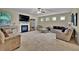 Spacious living room features a fireplace, plush seating, and ample natural light at 412 Live Oak Pass, Loganville, GA 30052