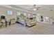 Bright primary bedroom with neutral carpeting, tray ceilings, and an ensuite bathroom with vanity at 412 Live Oak Pass, Loganville, GA 30052