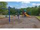 Community playground features a swing set and slides, providing a fun recreation area for families at 412 Live Oak Pass, Loganville, GA 30052