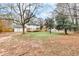 A spacious backyard featuring mature trees and a well-maintained lawn, ideal for outdoor activities and enjoyment at 2328 Carnes Rd, Jonesboro, GA 30236