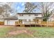 Expansive backyard featuring a deck, patio, and a well-maintained lawn, perfect for outdoor enjoyment at 2328 Carnes Rd, Jonesboro, GA 30236