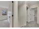Hallway featuring neutral paint, updated carpet, and ample storage space, ready for your personal touches at 2328 Carnes Rd, Jonesboro, GA 30236