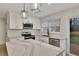 Modern kitchen features white cabinets, stainless appliances, and marble countertops at 2328 Carnes Rd, Jonesboro, GA 30236